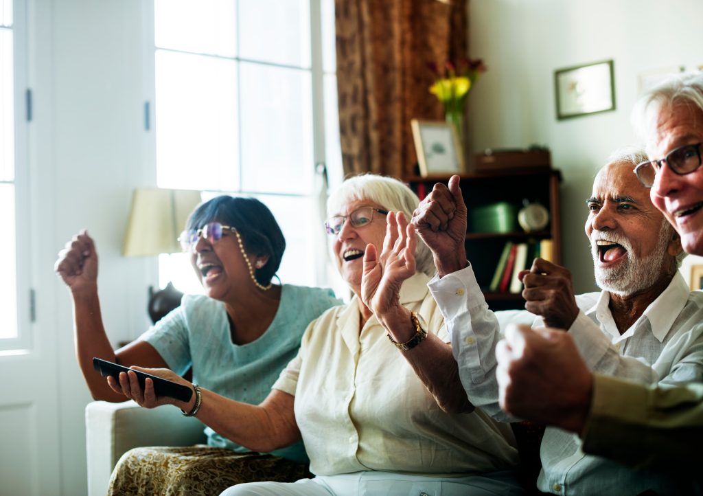 senior-people-watching-televison-together.