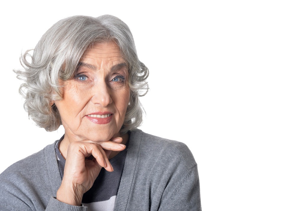 senior-woman-posing-against-white-background