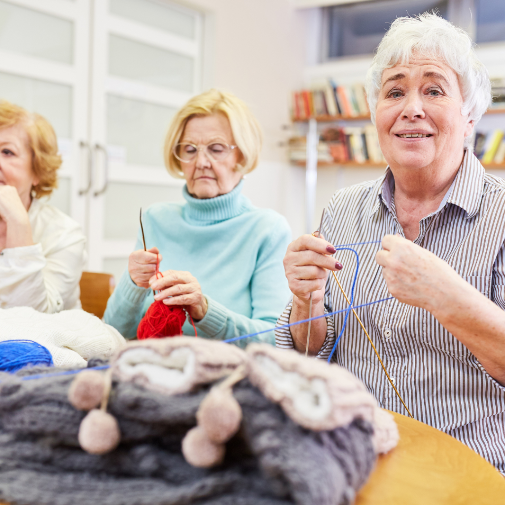 Two senior women knitting