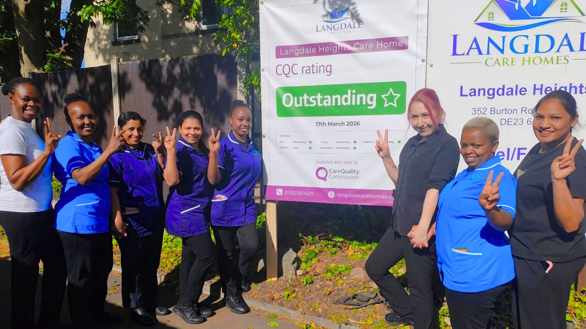 Langdale Heights Care Home staff celebrating CQC Outstanding rating with group recognition event